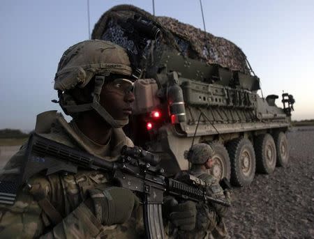 U.S. army soldiers of 2nd Battalion, 1st Infantry Regiment, take up position during a joint U.S.-Afghan military clearing operations in Nagahan district in Kandahar province, southern Afghanistan October 17, 2012. REUTERS/Erik De Castro