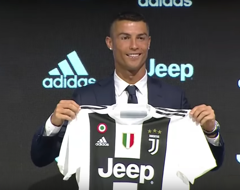 Ronaldo holds up his new jersey during his first press conference with Juventus on July 16. (Picture: Screenshot)