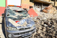 A damaged ambulance and hospital are pictured at a site hit by overnight airstrike, in Kafr Takharim, northwest of Idlib city, Syria April 25, 2017. REUTERS/Ammar Abdullah