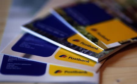 An illustration picture shows brochures of the Postbank AG on a table in Munich November 14, 2012. REUTERS/Michael Dalder