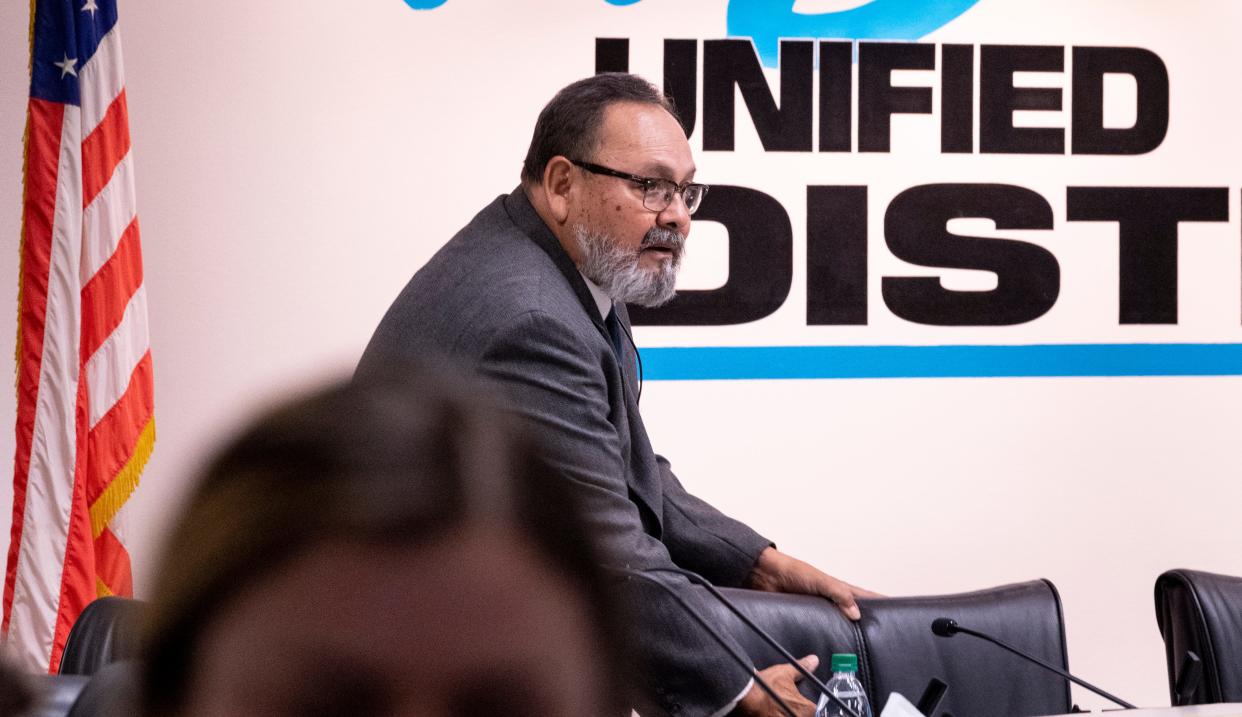 Visalia school board Trustee Juan Guerrero returns to his seat before the board announces they had voted to accept the resignation of Todd Oto on Tuesday, May 7, 2019.