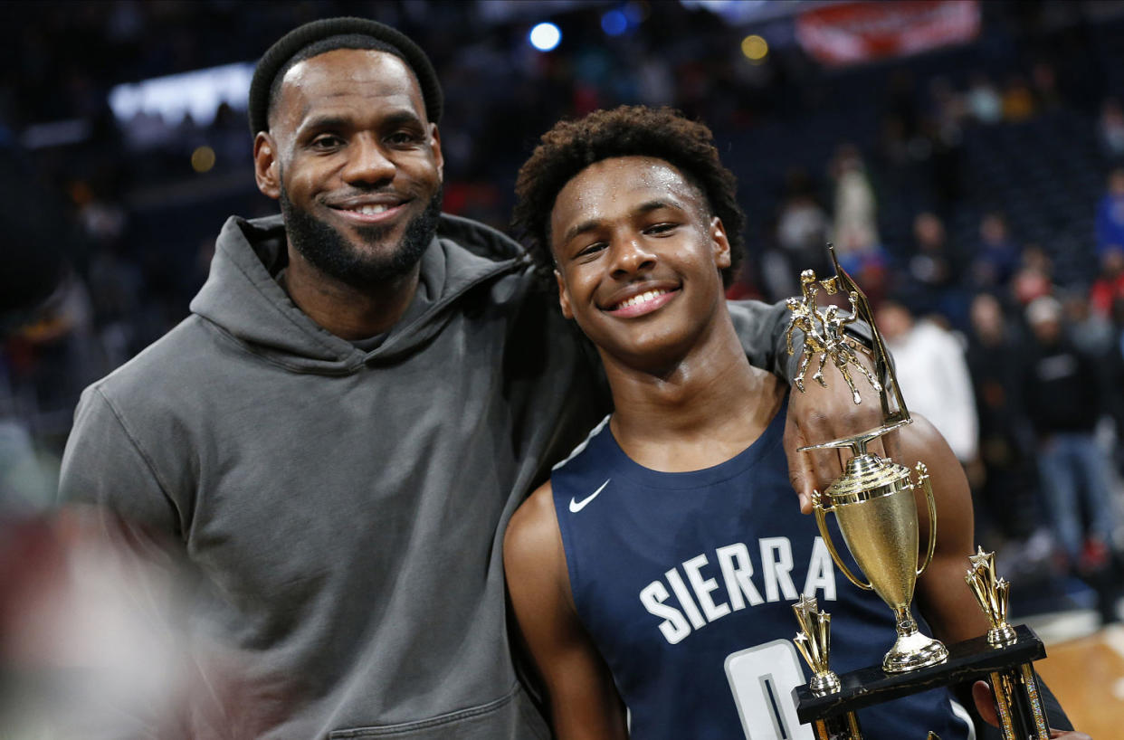 LeBron James with his son Bronny in Columbus, Ohio (Jay LaPrete / AP file )