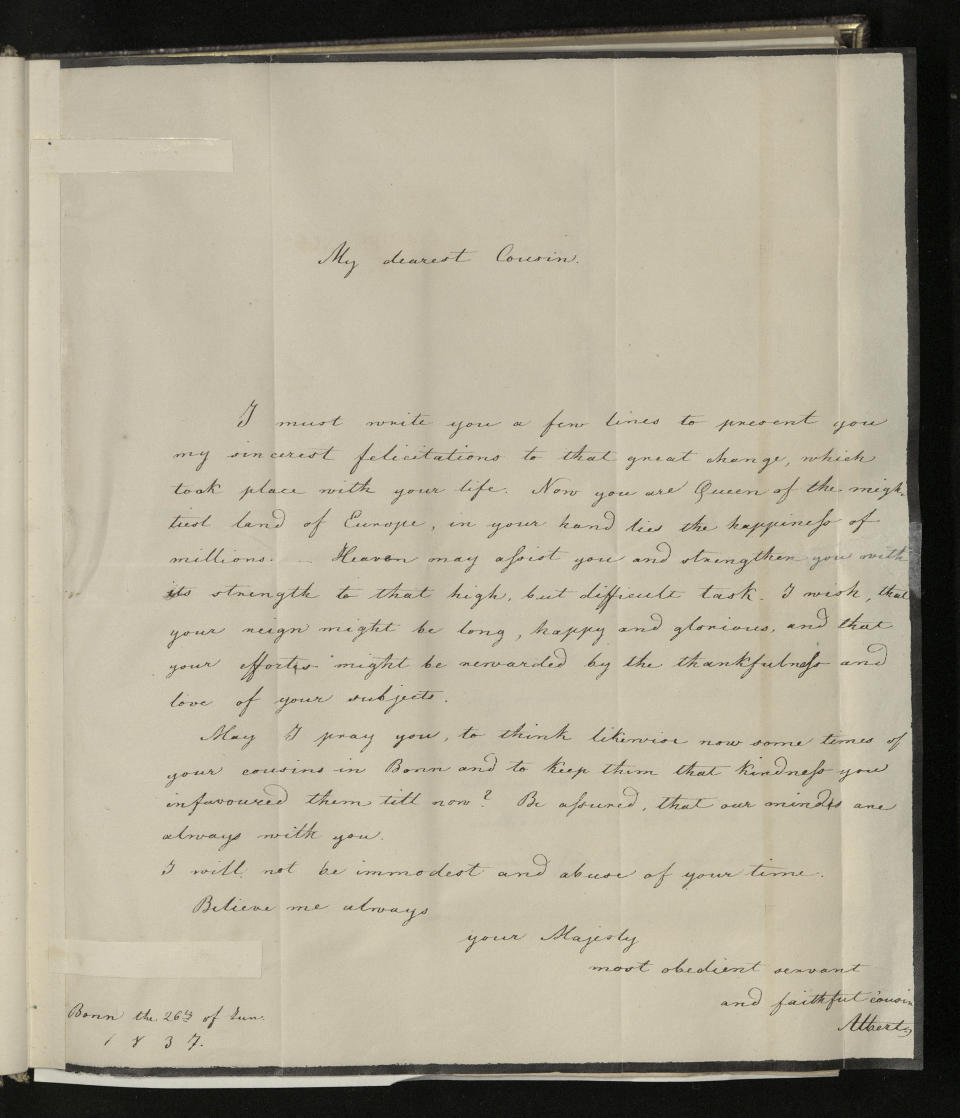 This undated image issued on Friday Aug. 23, 2019 by The Royal Collection shows a letter beginning 'My dearest cousin', written in June 1837, in which Albert congratulates Victoria on becoming Queen of England, wishing her reign to be long, happy and glorious. British royal documents, including images of Victoria’s leather-bound notebook, have been uploaded as part of thousands of documents and photos on the website www.albert.rct.uk that went online Friday to mark next week’s 200th anniversary of Albert’s birth. (The Royal Collection Trust via AP)