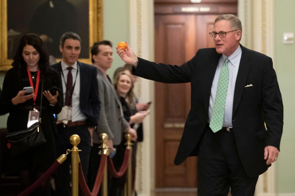 Sen. Richard Burr R-NC., displays a stress ball as he walks to the Senate Chamber prior to the start of the impeachment trial of President Donald Trump at the U.S. Capitol, Thursday, Jan. 23, 2020, in Washington. (AP Photo/Steve Helber)