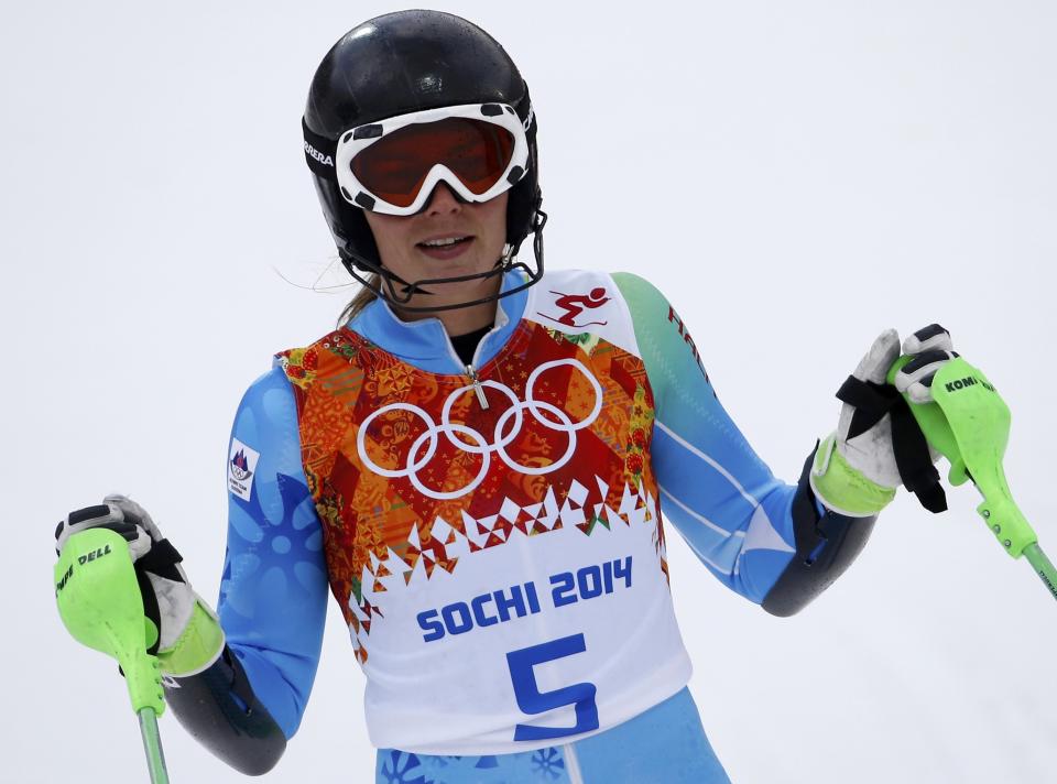 Slovenia's Tina Maze reacts in the finish area after competing in the first run of the women's alpine skiing slalom event during the 2014 Sochi Winter Olympics at the Rosa Khutor Alpine Center February 21, 2014. REUTERS/Leonhard Foeger (RUSSIA - Tags: SPORT OLYMPICS SPORT SKIING)