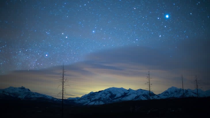 <span class="article__caption">Night sky and aurora borealis, Glacier National Park, Montana</span> (Photo: Noah Clayton/Getty)