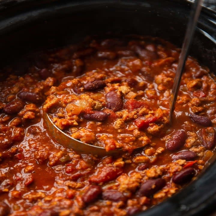 A slow cooker full of turkey chili.