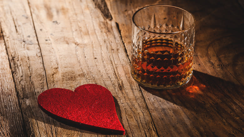 heart and glass of bourbon