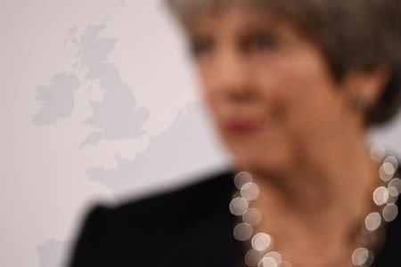 Britain's Prime Minister Theresa May stands in front of an image of the UK as she delivers a speech about her vision for Brexit, at Mansion House in London, Britain, March 2, 2018. REUTERS/Leon Neal/Pool/Files