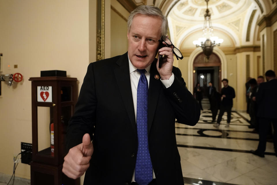 Rep. Mark Meadows, R-N.C., talks on the phone as the House of Representatives debates impeaching President Donald Trump on two charges, abuse of power and obstruction of Congress. (AP Photo/J. Scott Applewhite)