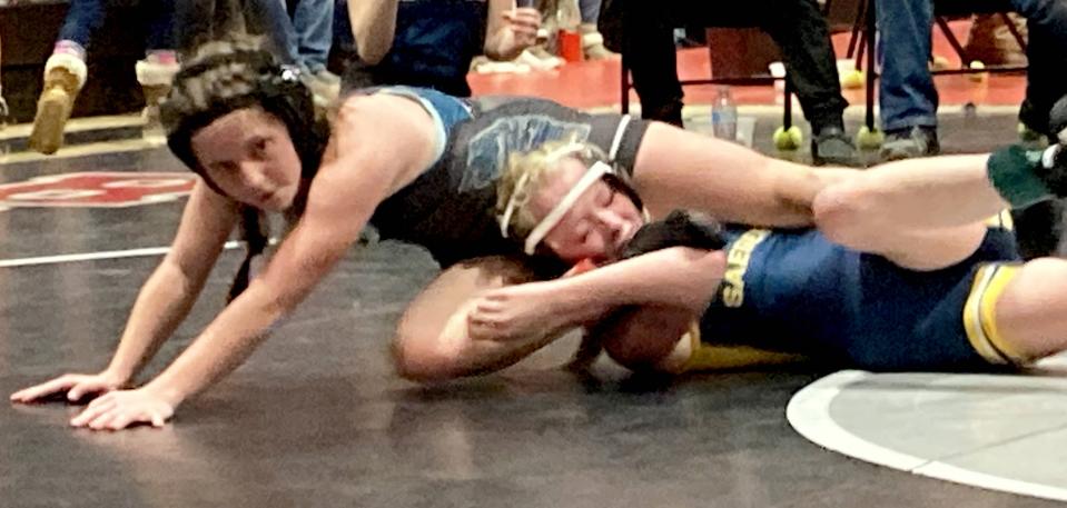 Fort LeBoeuf's Abby Falk escapes the grasp of Saegertown's Jazlee Green during their 100/106-pound match at Sunday's Hickory Invitational. Falk won with a 13-9 decision. The match was part of District 10's first PIAA-sanctioned girls wrestling competition.