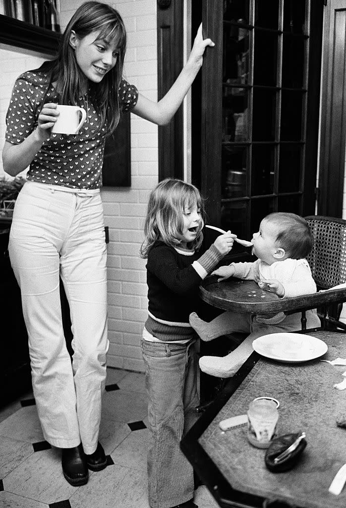 <p>The English model enjoys a cup of coffee while her daughter, Kate Barry, helps feed her newborn baby, Charlotte Gainsbourg. </p>