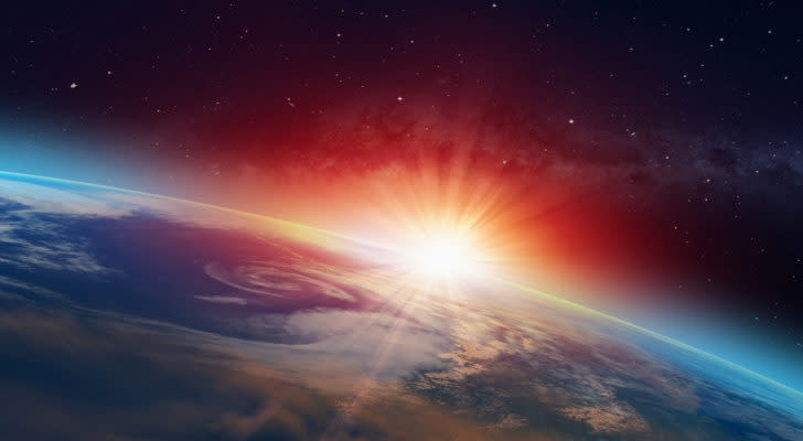 The sun cresting over the curvature of the Earth