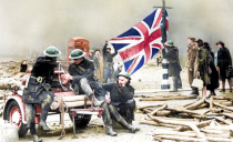 <p>Firemen proudly hang a Union Jack on a lamp post after a two-night attack on Plymouth, Devon. </p>