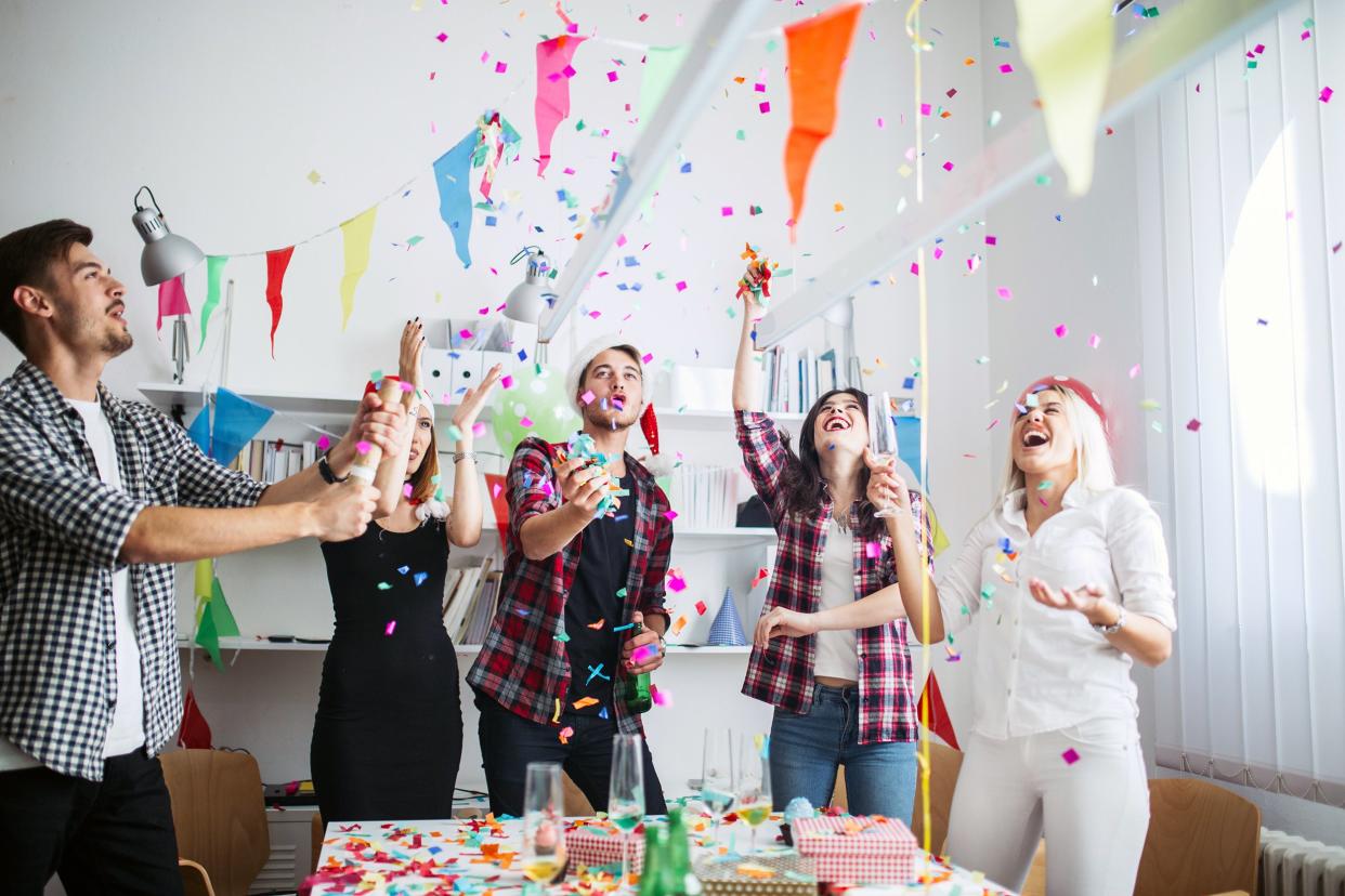 Friends having a party with confetti