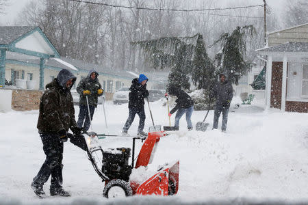 People clear the path at the Jersey shore in Monmouth Beach. REUTERS/Eduardo Munoz