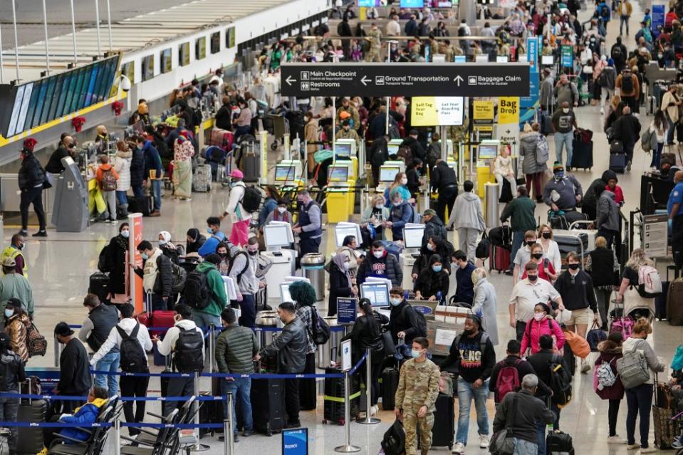 Passengers are seen at Hartsfield-Jackson Atlanta International Airport December 20, 2021. REUTERS