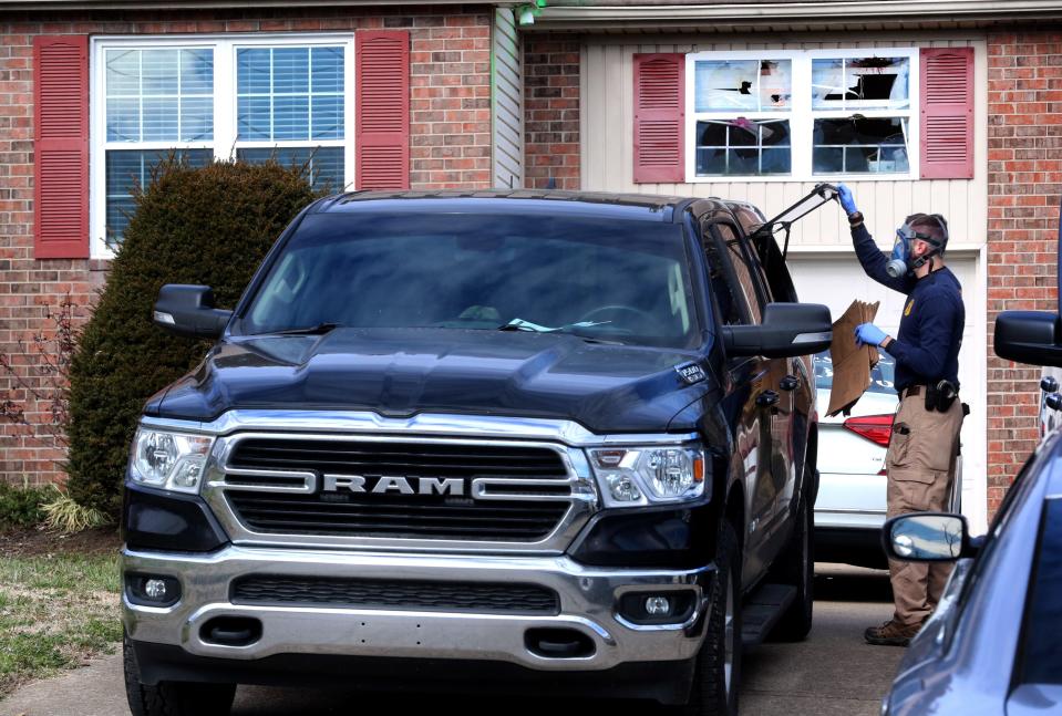 A Special Agent with the TBI comes out of a home on Odom Court to collect evidence bags on Monday, Jan. 24, 2022, in Smyrna Tenn.