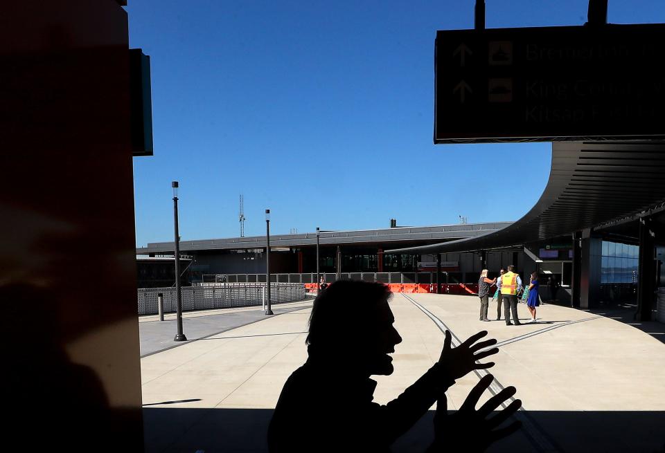 David Sowers, director of terminal engineering for Washington State Ferries, is silhouetted against the new elevated plaza as he talks about the WSF terminal project at Colman Dock in Seattle on Wednesday.