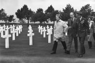 FILE - In this Jan.5, 1977 file photo President Jimmy Carter, French President Valery Giscard d'Estaing and Brig. General John Donaldson, chairman, American Battle Monuments Commission, walk past the graves of American soldiers killed in the invasion of the Normandy beaches during World War II. Valery Giscard d’Estaing, the president of France from 1974 to 1981 who became a champion of European integration, has died Wednesday, Dec. 2, 2020 at the age of 94, his office and the French presidency said. (AP Photo, File)