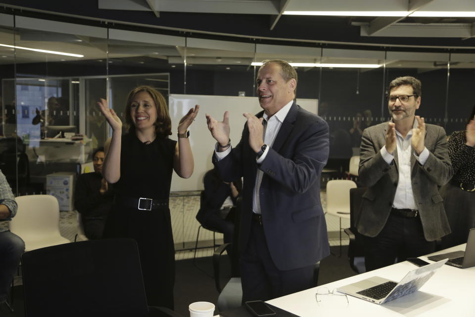 Associated Press Executive Editor Julie Pace, left, Director of Photography David Ake, center, and Paul Haven, Director of Global Newsgathering, celebrate on Monday, May 8, 2023, in New York after it was announced that the A.P. won a Pulitzer Prize for breaking news photography. The AP has won two Pulitzer Prizes in journalism for its coverage of the Russian invasion in Ukraine, in the categories of public service and breaking news photography. (AP Photo/Peter Morgan)