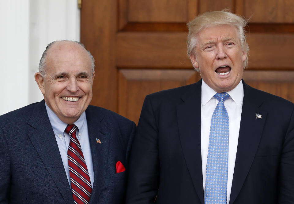 President-elect Donald Trump calls out to media as he and former New York Mayor Rudy Giuliani pose for photographs as Giuliani arrives at the Trump National Golf Club Bedminster clubhouse, Sunday, Nov. 20, 2016, in Bedminster, N.J. (Photo: ASSOCIATED PRESS)
