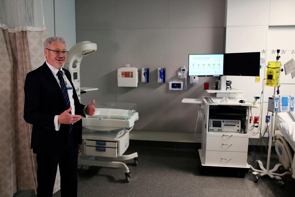 Hospital President Darin Roark explains the details of a labor and delivery room at the newly opened Baptist Medical Center Clay on Fleming Island.