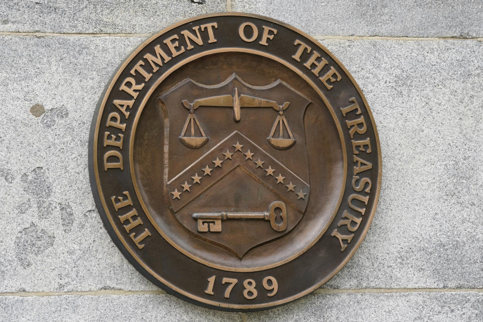 FILE - The Department of the Treasury's seal outside the Treasury Department building in Washington on May 4, 2021. The national debt is at the core of a dispute about how to raise the government's legal borrowing authority, which could come to a head this summer if the government runs out of accounting maneuvers to keep paying its bills. (AP Photo/Patrick Semansky, File)