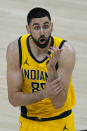 Indiana Pacers center Goga Bitadze reacts after fouling Utah Jazz center Rudy Gobert (27) in the first half of an NBA basketball game Friday, April 16, 2021, in Salt Lake City. (AP Photo/Rick Bowmer)