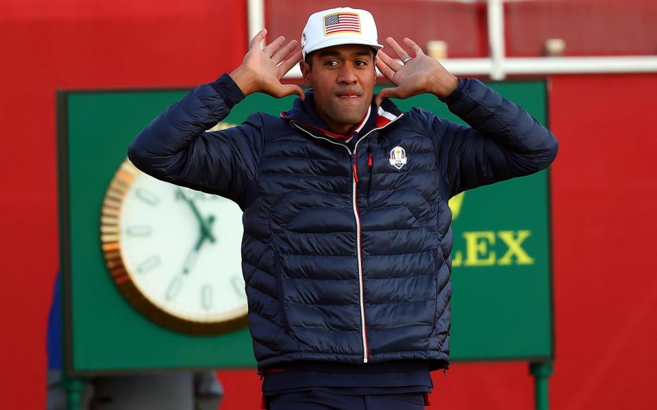 Tony Finau tries to gee up the crowd at the start of day one - GETTY IMAGES