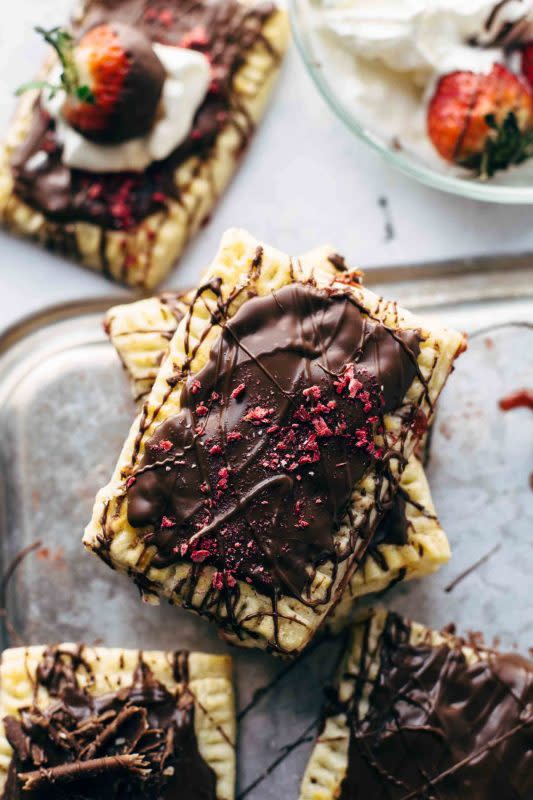 <p>Also The Crumbs Please</p><p>Buttery, flaky pie crust and sweet vanilla strawberry jam both made from scratch.</p><p><strong>Get the recipe: <a href="https://www.alsothecrumbsplease.com/chocolate-strawberry-pop-tarts-recipe/" rel="nofollow noopener" target="_blank" data-ylk="slk:Chocolate Strawberry Pop Tarts;elm:context_link;itc:0;sec:content-canvas" class="link rapid-noclick-resp"><em>Chocolate Strawberry Pop Tarts</em></a></strong></p>