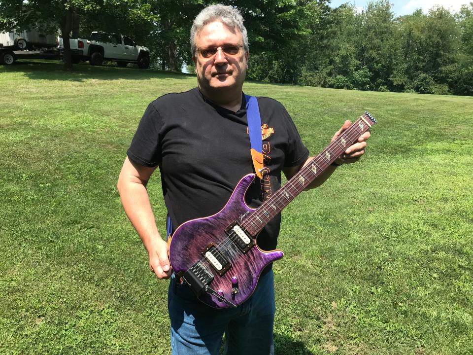 Jim Jaros with his headless H Model One guitar.