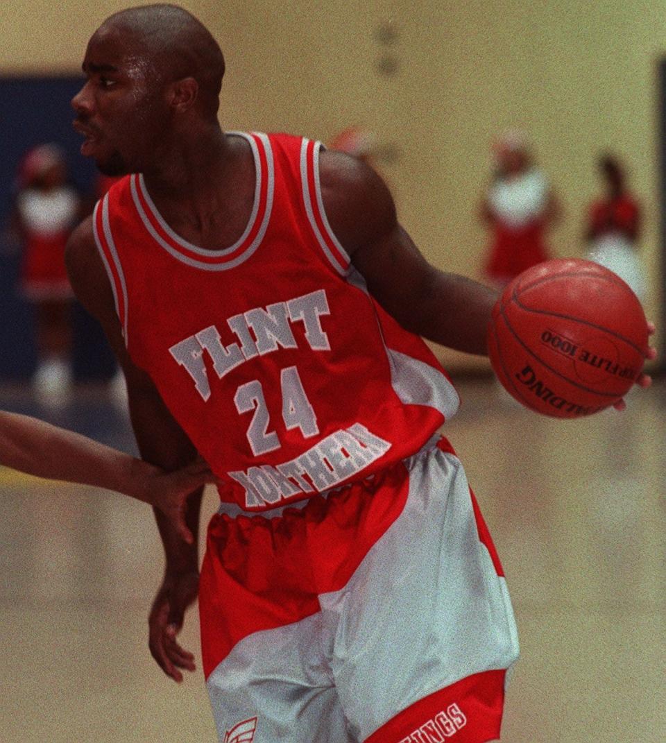 Flint Northern's Mateen Cleaves looks towards the basket during Friday's game against Sexton at Eastern High's Don Johnson Fieldhouse in January 1996.