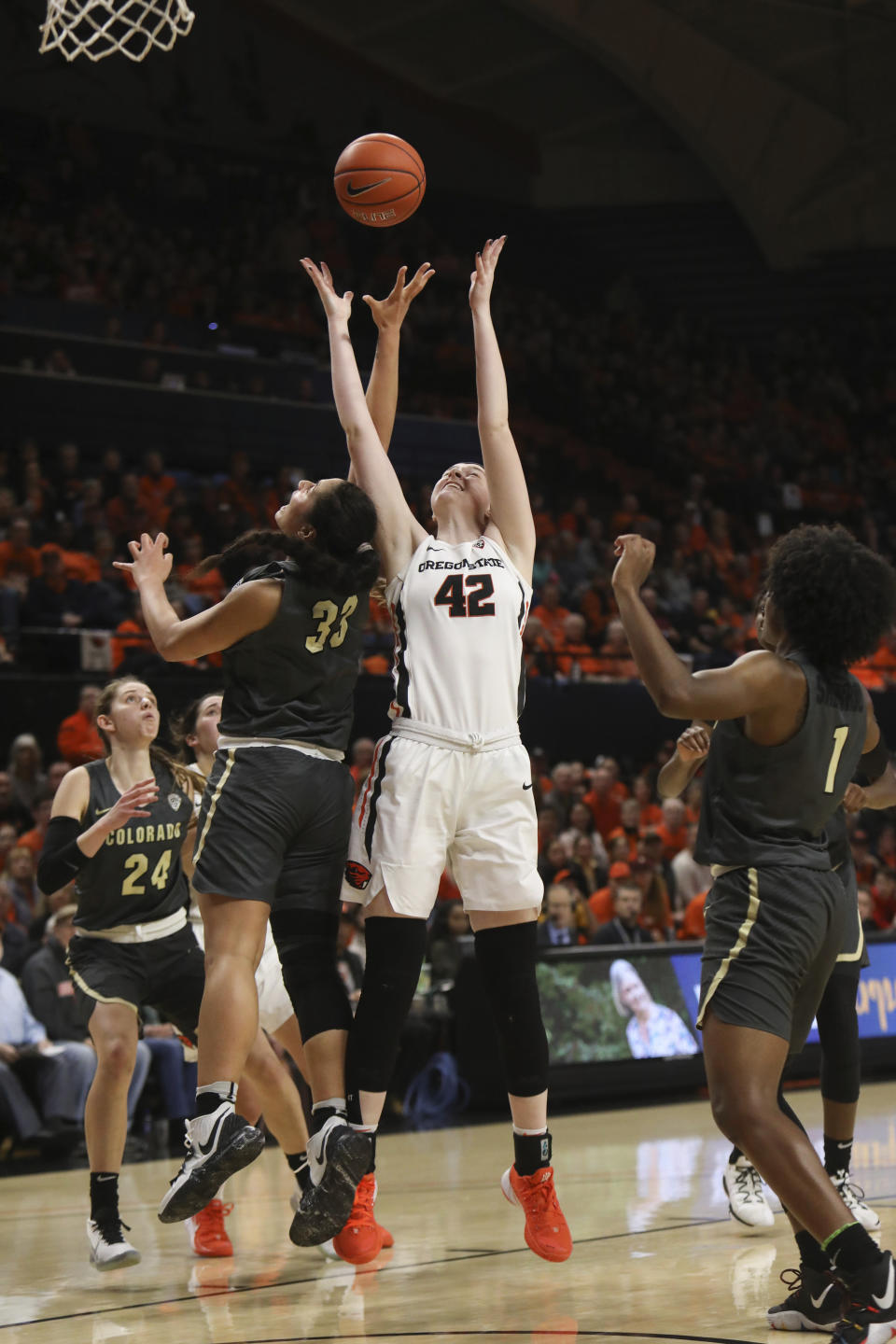 Oregon State's Kennedy Brown (42) and Colorado's Peanut Tuitele (33) fight for possession of a rebound during the first half of an NCAA college basketball game in Corvallis, Ore., Sunday, Jan. 5, 2020. (AP Photo/Amanda Loman)