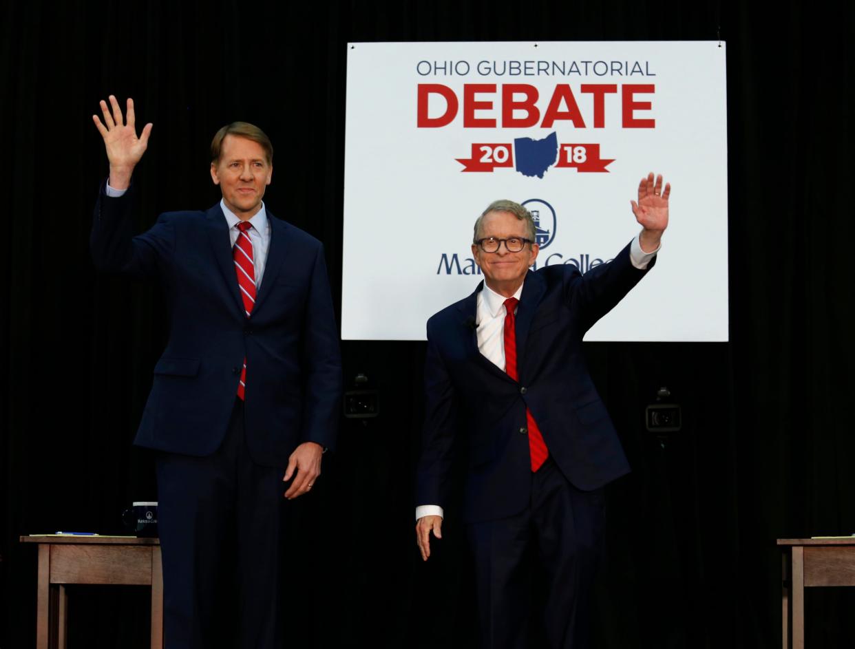 Gov. Mike DeWine debated his Democratic challenger Richard Cordray, left, in 2018. So far, DeWine has declined to debate Nan Whaley this year. Paul Vernon/AP