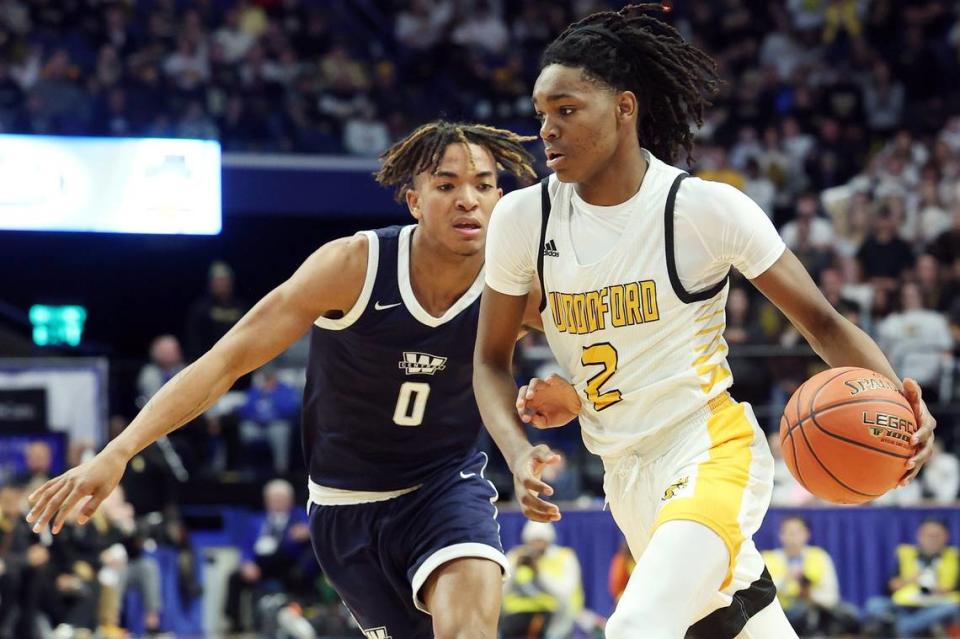 Former Woodford County boys basketball player Jasper Johnson (2) drives near Warren Central’s Damarion Walkup (0) during a semifinal game in the 2023 Sweet 16. Johnson is a five-star recruit in the 2025 recruiting class.