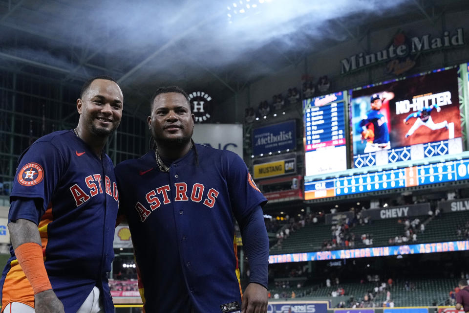 Houston Astros starting pitcher Framber Valdez, right, and catcher Martin Maldonado pose for a photograph after a no-hitter against the Cleveland Guardians, Tuesday, Aug. 1, 2023, in Houston. (AP Photo/Kevin M. Cox)