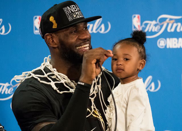 <p>John W. McDonough /Sports Illustrated/Getty</p> LeBron James with daughter Zhuri during press conference after winning series vs Golden State Warriors at Oracle Arena on June 19, 2016.