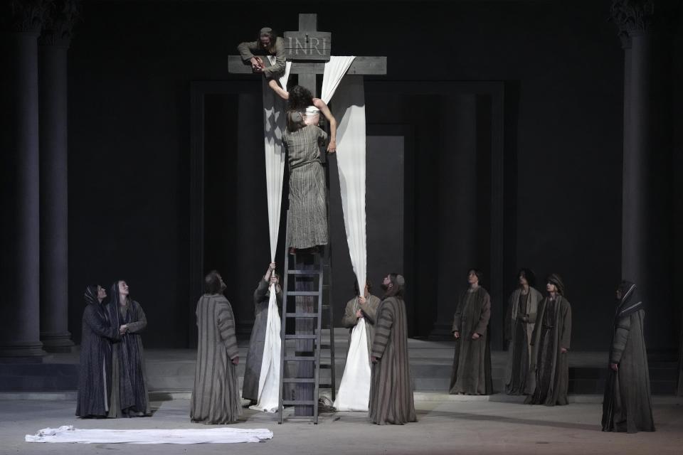 Rochus Rueckel as Jesus performs with cast members during the rehearsal of the 42nd Passion Play in Oberammergau, Germany, Wednesday, May 4, 2022. More than 1800 citizens of this Bavarian village participate in the century-old play of the suffering of Christ, staged every ten years and dating back to 1634. (AP Photo/Matthias Schrader)