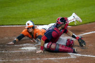 Baltimore Orioles' Ryan Mountcastle, left, slides in ahead of the tag by Boston Red Sox catcher Kevin Plawecki on a fielders choice ground ball by Orioles' Maikel Franco during the eighth inning of a baseball game, Saturday, April 10, 2021, in Baltimore. The Red Sox won 6-4 in ten innings. (AP Photo/Julio Cortez)