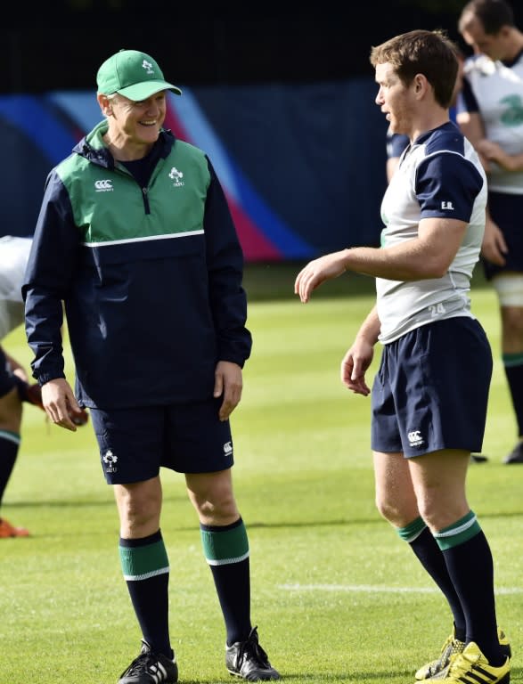 Ireland's head coach Joe Schmidt (L) talks to scrum-half Eoin Reddan during a team training session in Newport, south Wales, on October 9, 2015, during the Rugby World Cup