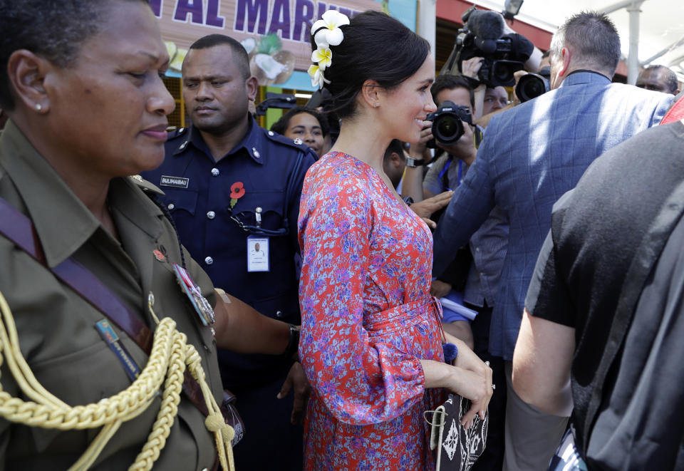 Meghan, Duchess of Sussex during a visit to a market in Suva, Fiji, Wednesday, Oct. 24, 2018. Britain's Prince Harry and his wife Meghan are on day nine of their 16-day tour of Australia and the South Pacific.(AP Photo/Kirsty Wigglesworth, Pool)