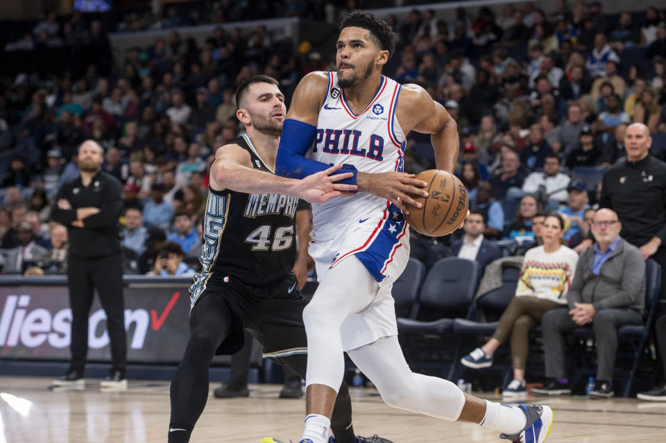 Philadelphia 76ers forward Tobias Harris, front right, drives against Memphis Grizzlies guard John Konchar (46) in the second half of an NBA basketball game Friday, Dec. 2, 2022, in Memphis, Tenn. (AP Photo/Brandon Dill)