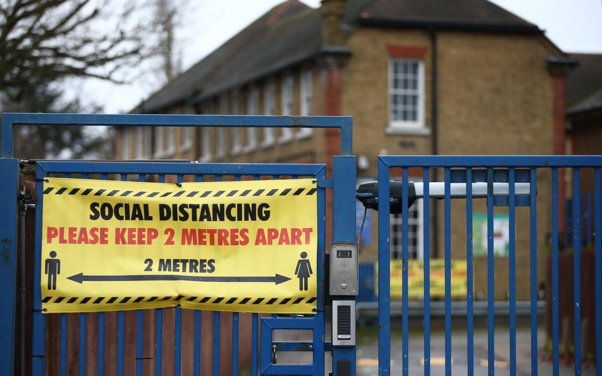 A general view of social distancing signs displayed at Coldfall Primary School in Muswell Hill on January 2, 2021 - Hollie Adams/Getty Images Europe