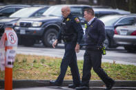 Newport News Fire Chief Jeff Johnson and a Fire Marshall walk into Richneck Elementary School on Monday Jan. 30, 2023 in Newport News, Va. The Virginia elementary school where a 6-year-old boy shot his teacher has reopened with stepped-up security and a new administrator. (AP Photo/John C. Clark)