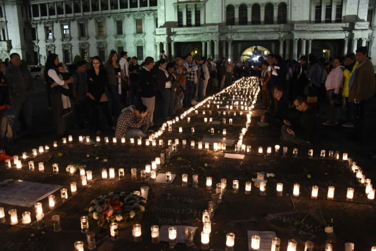 People take part in a protest at the Square of the Constitution in Guatemala City on March 9, 2017, following the death of 40 girls in a recent fire at a government-run children's shelter in San Jose Pinula, east of the capital