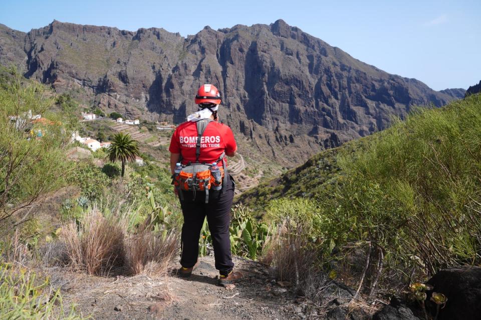 A firefighter looks over the village of Masca, Tenerife, while the search is ongoing (James Manning/PA) (PA Wire)