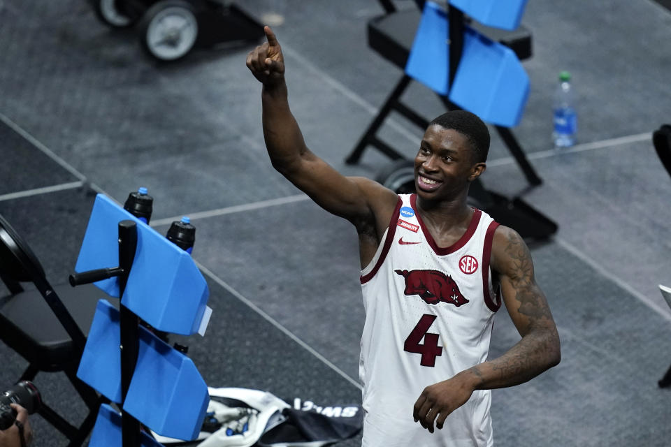 Arkansas guard Davonte Davis celebrates after a Sweet 16 game against Oral Roberts in the NCAA men's college basketball tournament at Bankers Life Fieldhouse, Saturday, March 27, 2021, in Indianapolis. Arkansas won 72-70. (AP Photo/Darron Cummings)