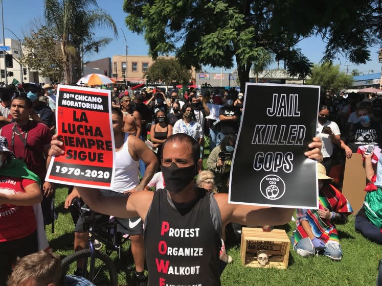 Protesters gather Sautrday, August 29, 2020, at Ruben Salazar Park in Los Angeles to commemorate the 50th anniversary of the Chicao Moratorium.