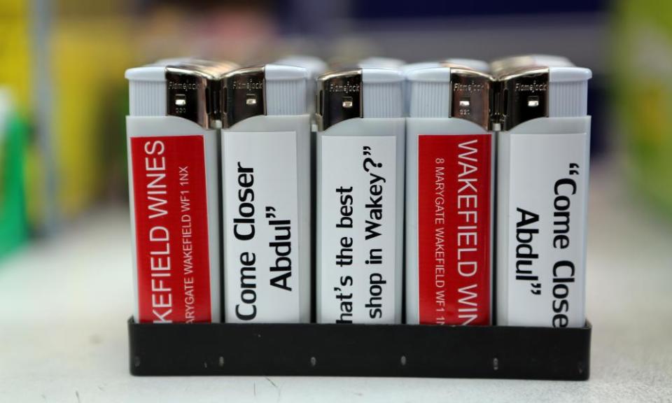 Close-up of lighters with slogans